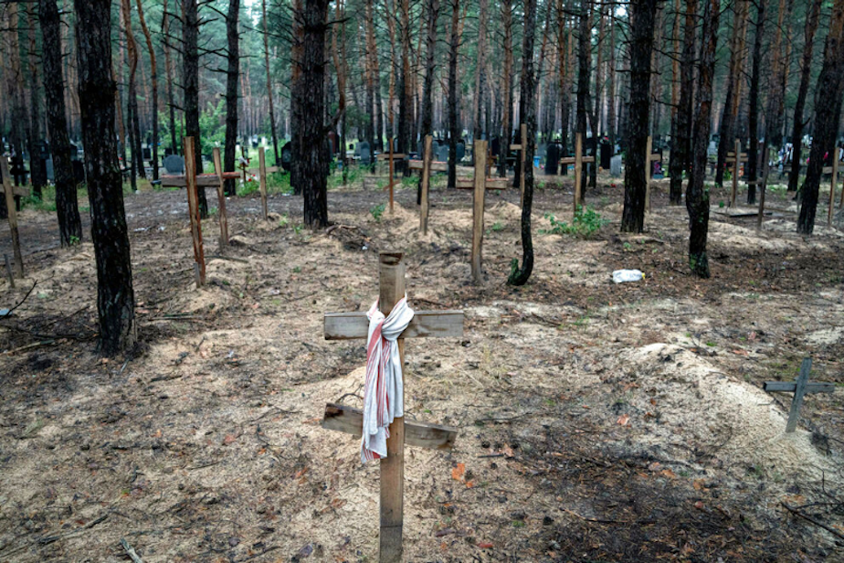 caption: A view shows unidentified graves of civilians and Ukrainian soldiers in a cemetery, in the recently retaken area of Izium, Ukraine, Friday, Sept. 16, 2022. Ukrainian authorities discovered a mass burial site near the recaptured city of Izium that contained hundreds of graves. It was not clear who was buried in many of the plots or how all of them died, though witnesses and a Ukrainian investigator said some were shot and others were killed by artillery fire, mines or airstrikes. 