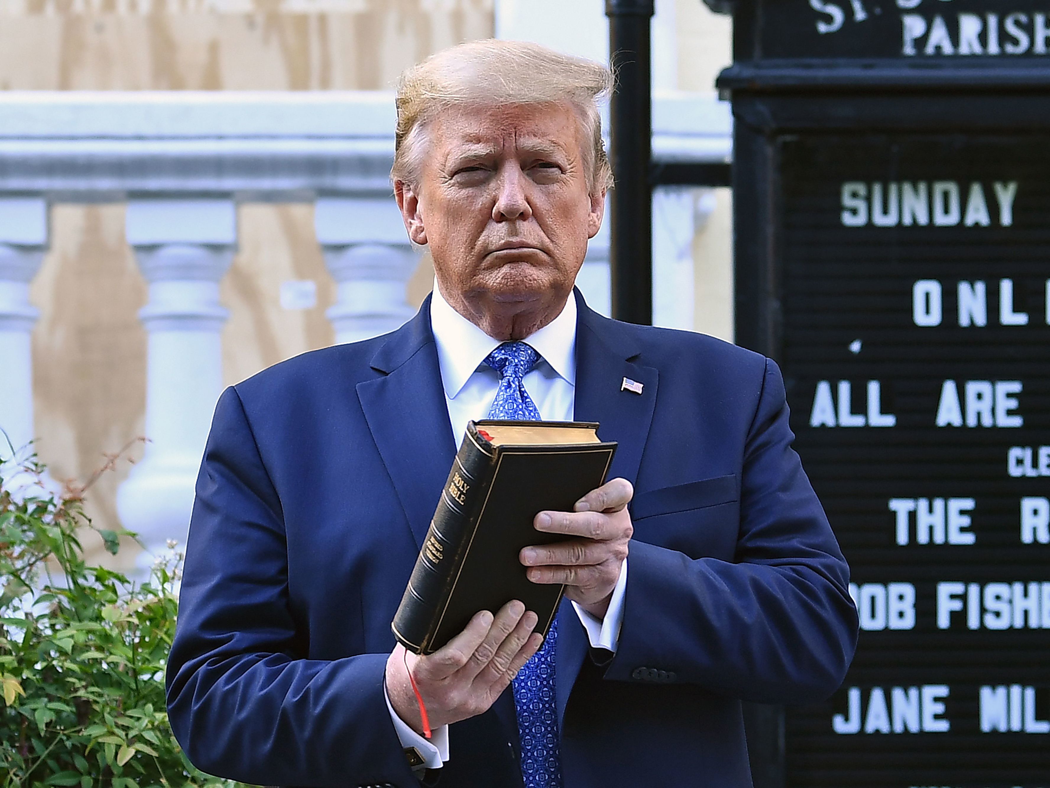 caption: Then-President Trump holds up a Bible outside of St John's Episcopal Church on June 1, 2020, after days of anti-racism protests against police brutality. President Biden has rescinded several orders Trump made during his last year in office, including moves to protect Confederate statues being dismantled by protesters last year.