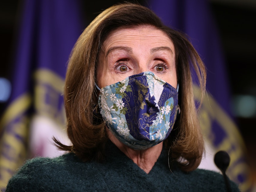 caption: Nancy Pelosi, D-Calif., holds her weekly news conference on Jan. 28.