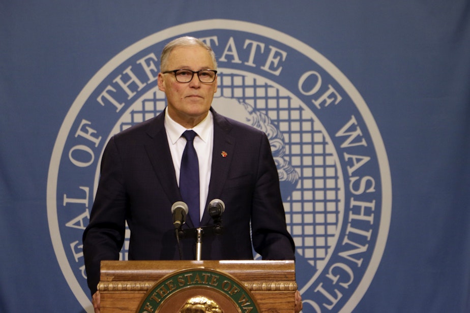 caption: Washington Gov. Jay Inslee speaks to the media after the Legislature adjourned its 60-day session, Thursday, March 12, 2020, in Olympia, Wash. State lawmakers passed a supplemental budget with funding for the state's response to COVID-19. 