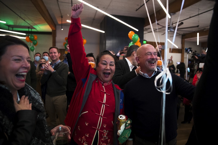 caption: Supporters of Bruce Harrell, including Shiao-Yen Wu, center, react to initial results during an election night gathering for Harrell on Tuesday, November 2, 2021, at Block 41 on Bell Street in Seattle.