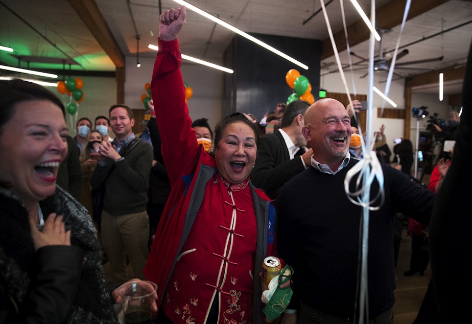 caption: Supporters of Bruce Harrell, including Shiao-Yen Wu, center, react to initial results during an election night gathering for Harrell on Tuesday, November 2, 2021, at Block 41 on Bell Street in Seattle.