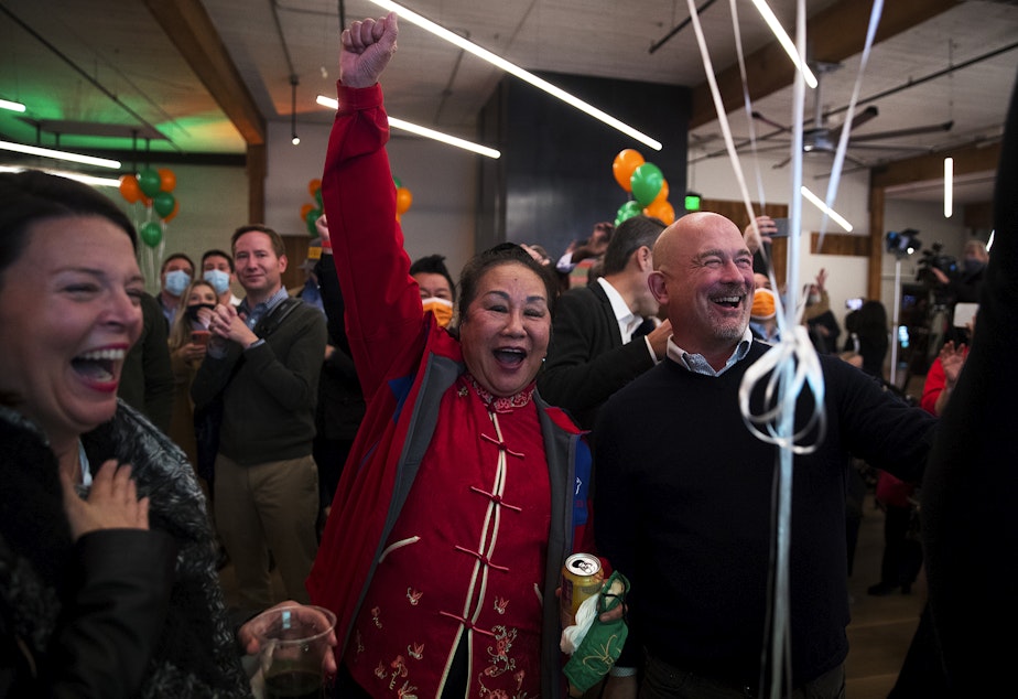 caption: Supporters of Bruce Harrell, including Shiao-Yen Wu, center, react to initial results during an election night gathering for Harrell on Tuesday, November 2, 2021, at Block 41 on Bell Street in Seattle.