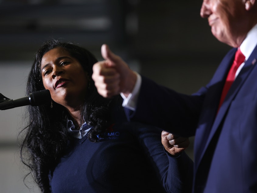 caption: Kristina Karamo, who is headed toward becoming the Republican nominee for secretary of state in Michigan, gets an endorsement from Trump during his April 2 rally.