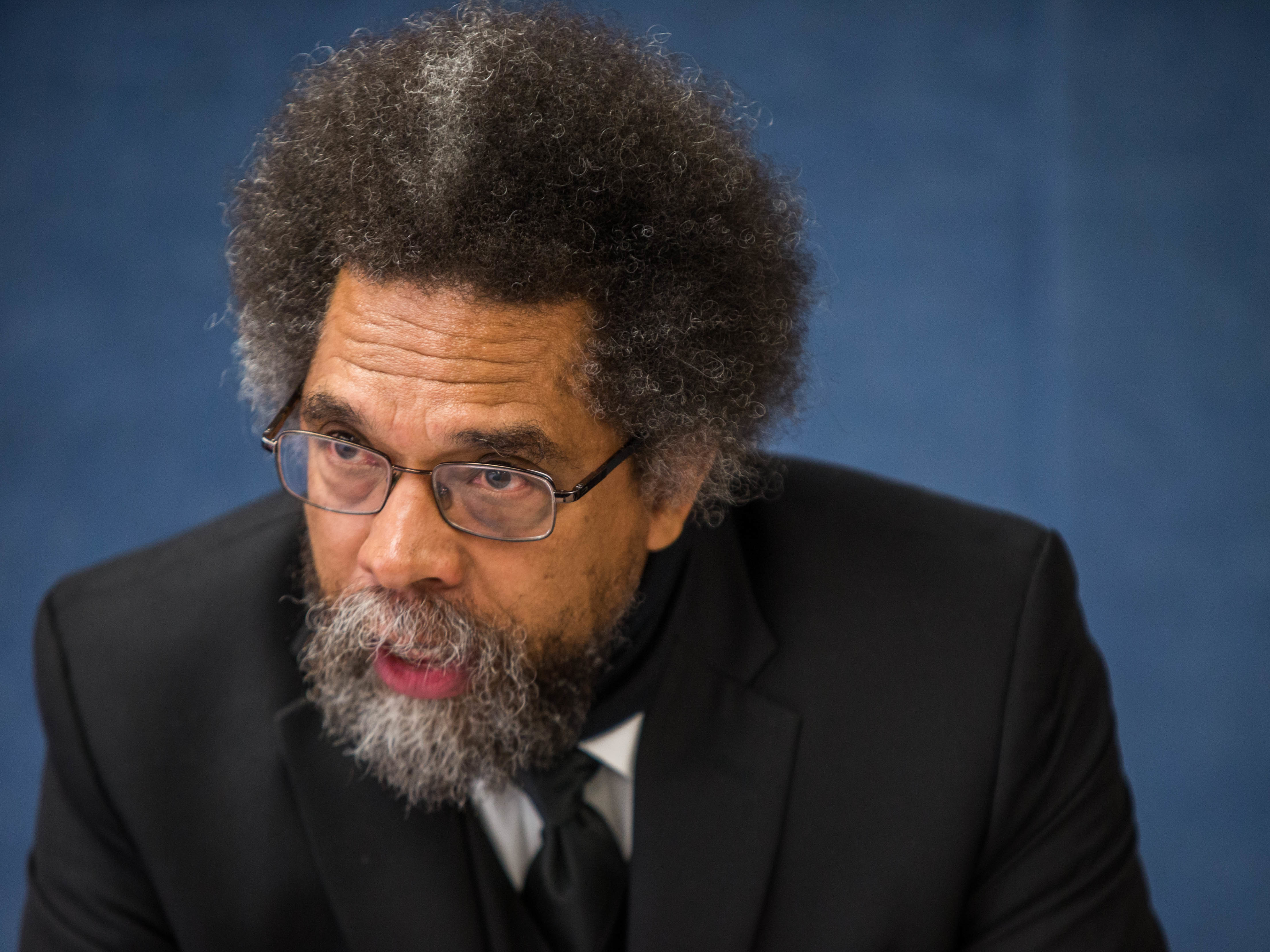 caption: Cornel West, here at the National Press Club in Washington, D.C., in 2016, suggests in his resignation letter that politics were a factor in Harvard University's decision not to extend tenure to him.