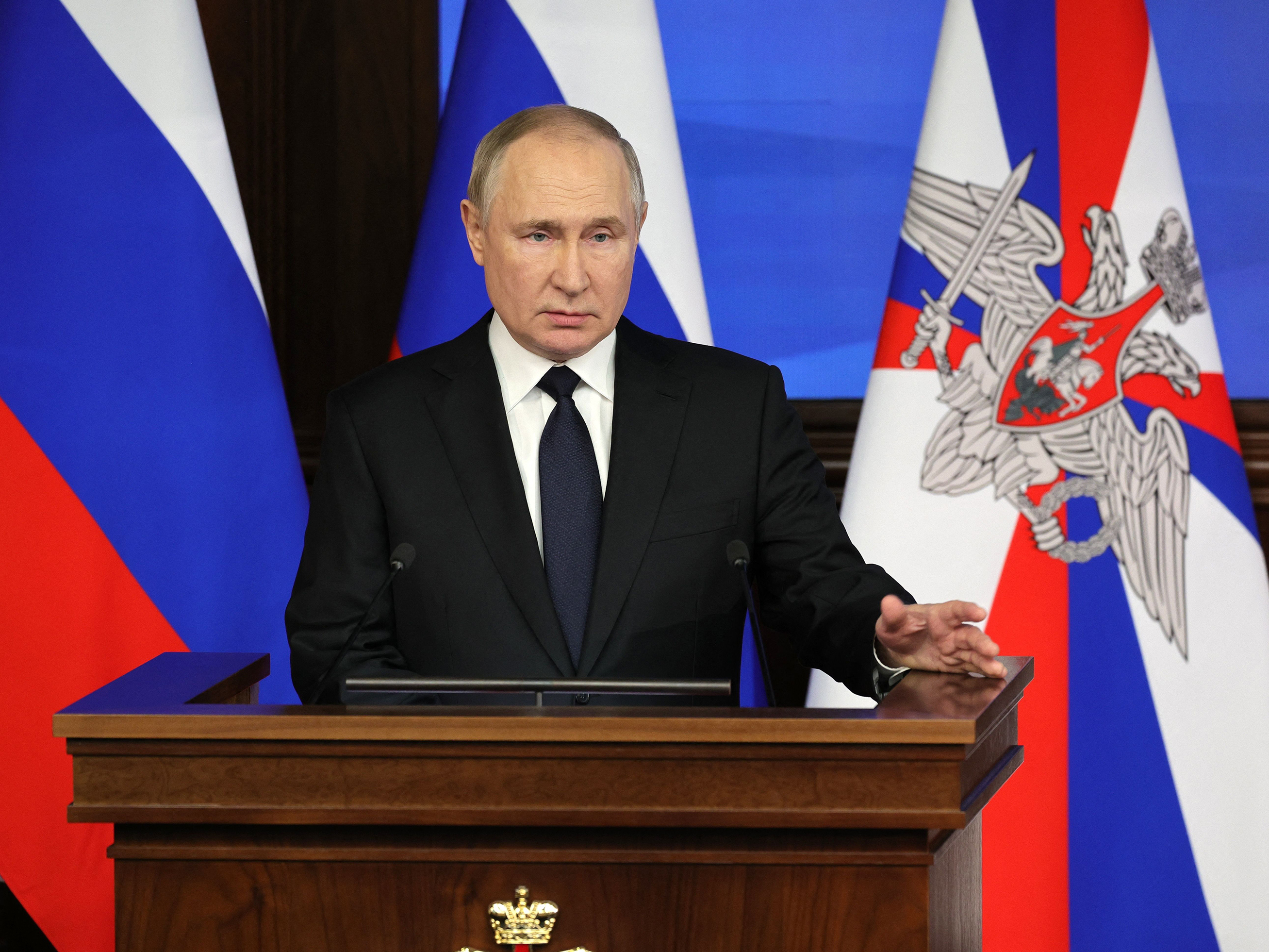 caption: Russian President Vladimir Putin delivers a speech during an expanded meeting of the Russian Defense Ministry Board at the National Defense Control Center in Moscow, on Wednesday.