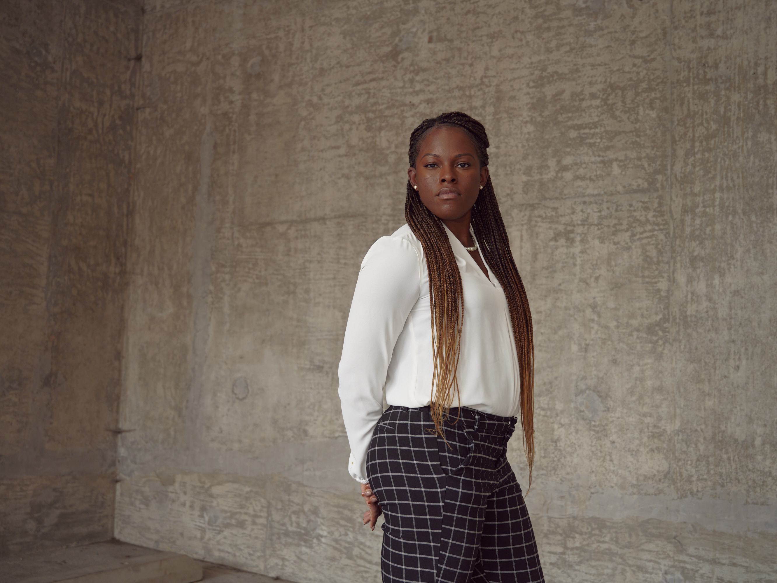 caption: Crystal Ellington, a Black Army veteran, says she was disciplined for returning to base late after a flight delay, while white service members were given a pass for tardiness.