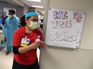 caption: Nurses remain under pressure as the U.S. faces another COVID winter.