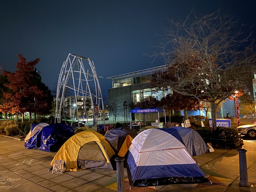 caption: Tents set up outside Burien City Hall on Saturday, Nov. 11, 2023.
