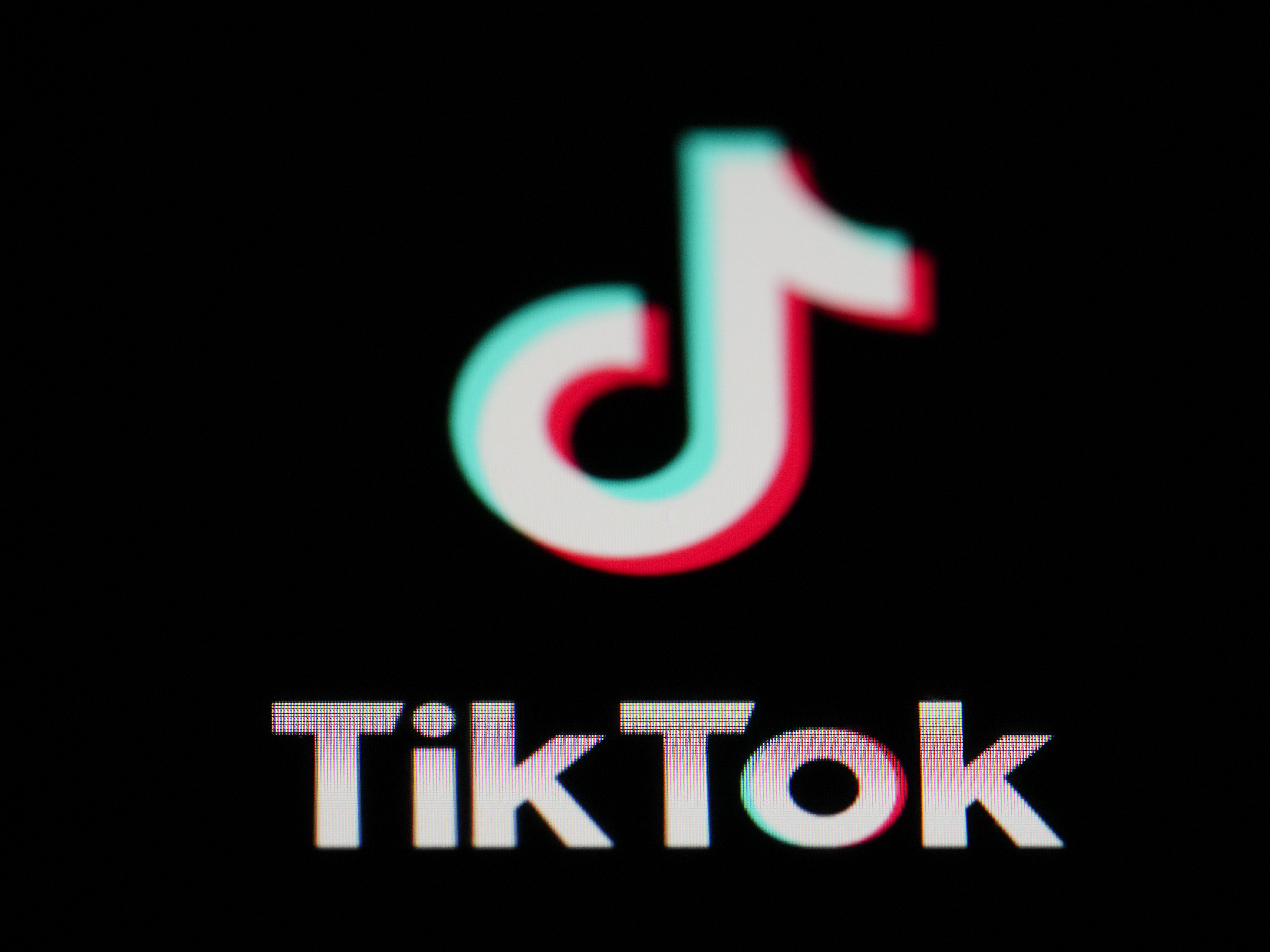 caption: The icon for the video sharing TikTok app is seen on a smartphone, Feb. 28, 2023, in Marple Township, Pa.