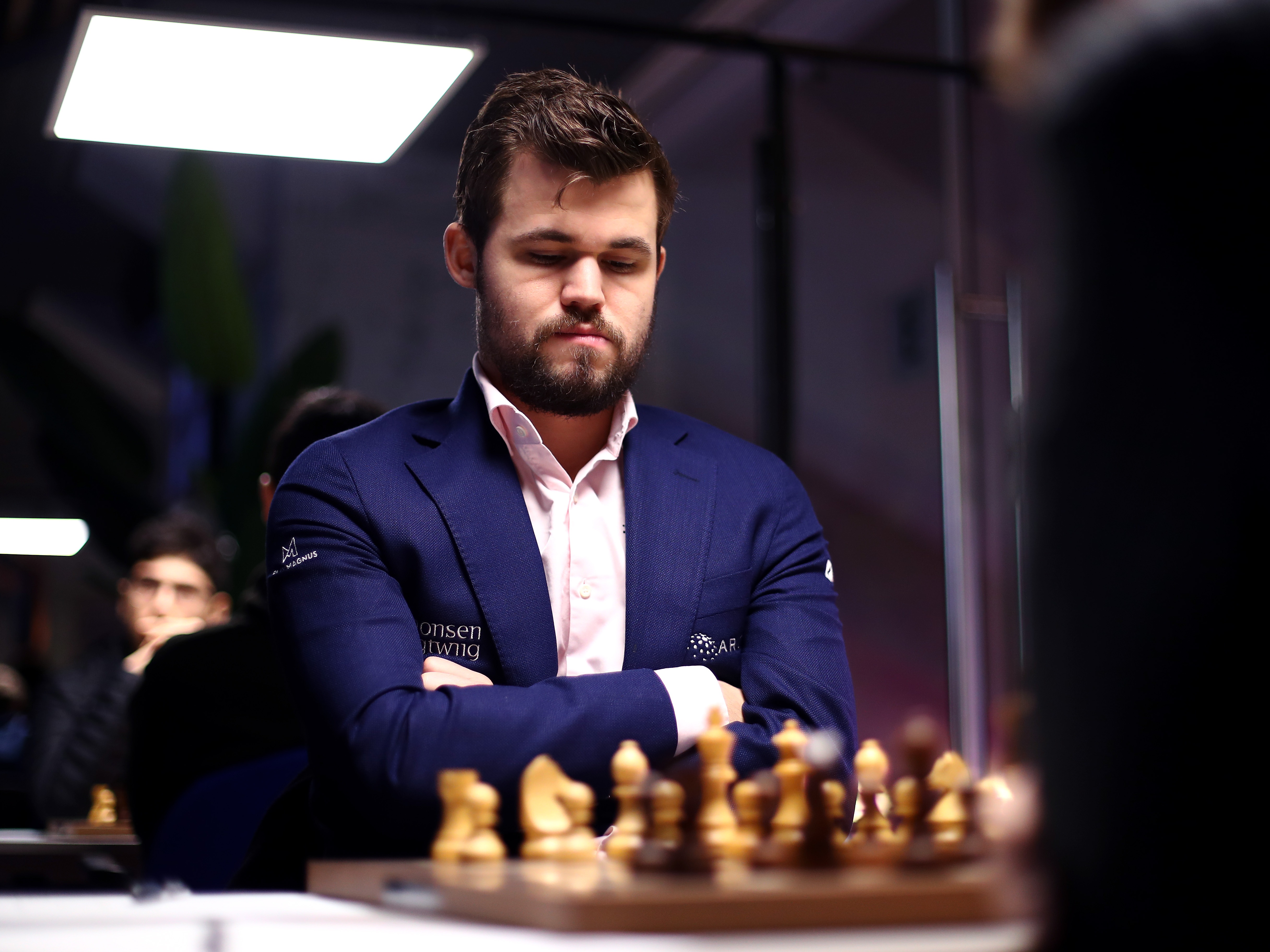 caption: Magnus Carlsen of Norway competes against Daniil Dubov of Russia during the 82nd Tata Steel Chess Tournament in Eindhoven, Netherlands, on Jan. 16, 2020.