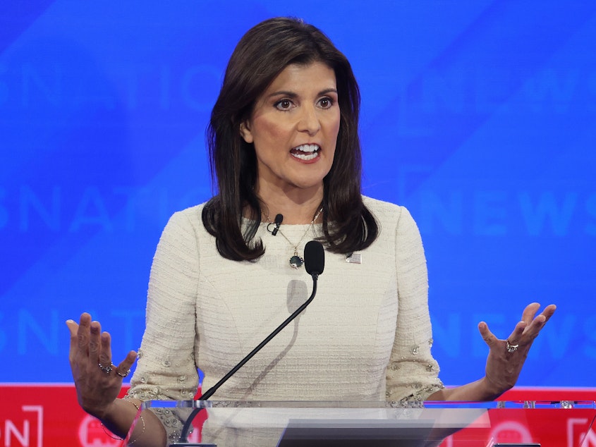 caption: Republican presidential candidate Nikki Haley participates in fourth Republican Presidential Primary Debate on on December 6, 2023 in Tuscaloosa, Alabama.