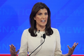 caption: Republican presidential candidate Nikki Haley participates in fourth Republican Presidential Primary Debate on on December 6, 2023 in Tuscaloosa, Alabama.