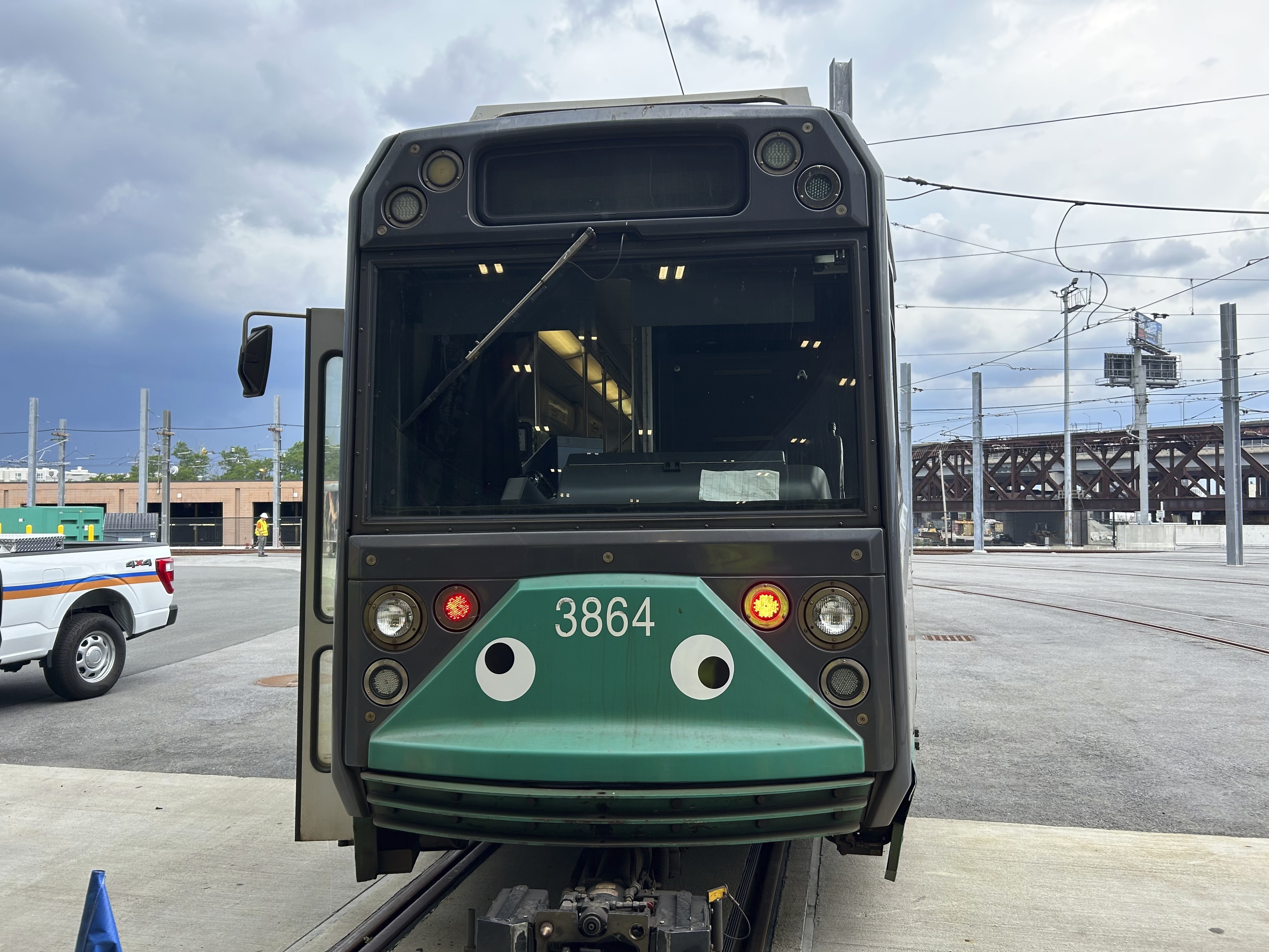 caption: An MBTA subway car dons googly eyes under its front windshield in Boston.