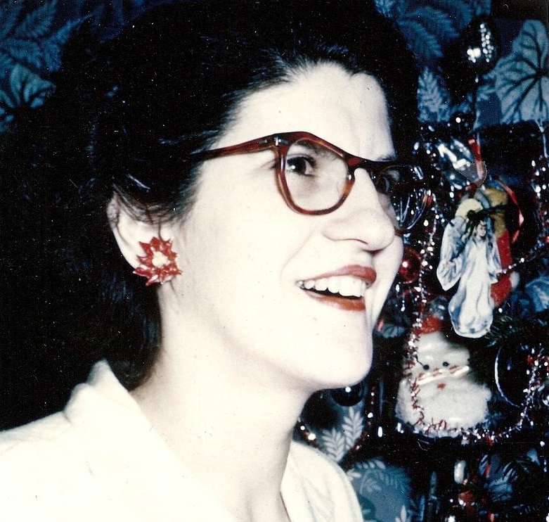 caption: Georgie, age 35, wearing her favorite Christmas earrings.