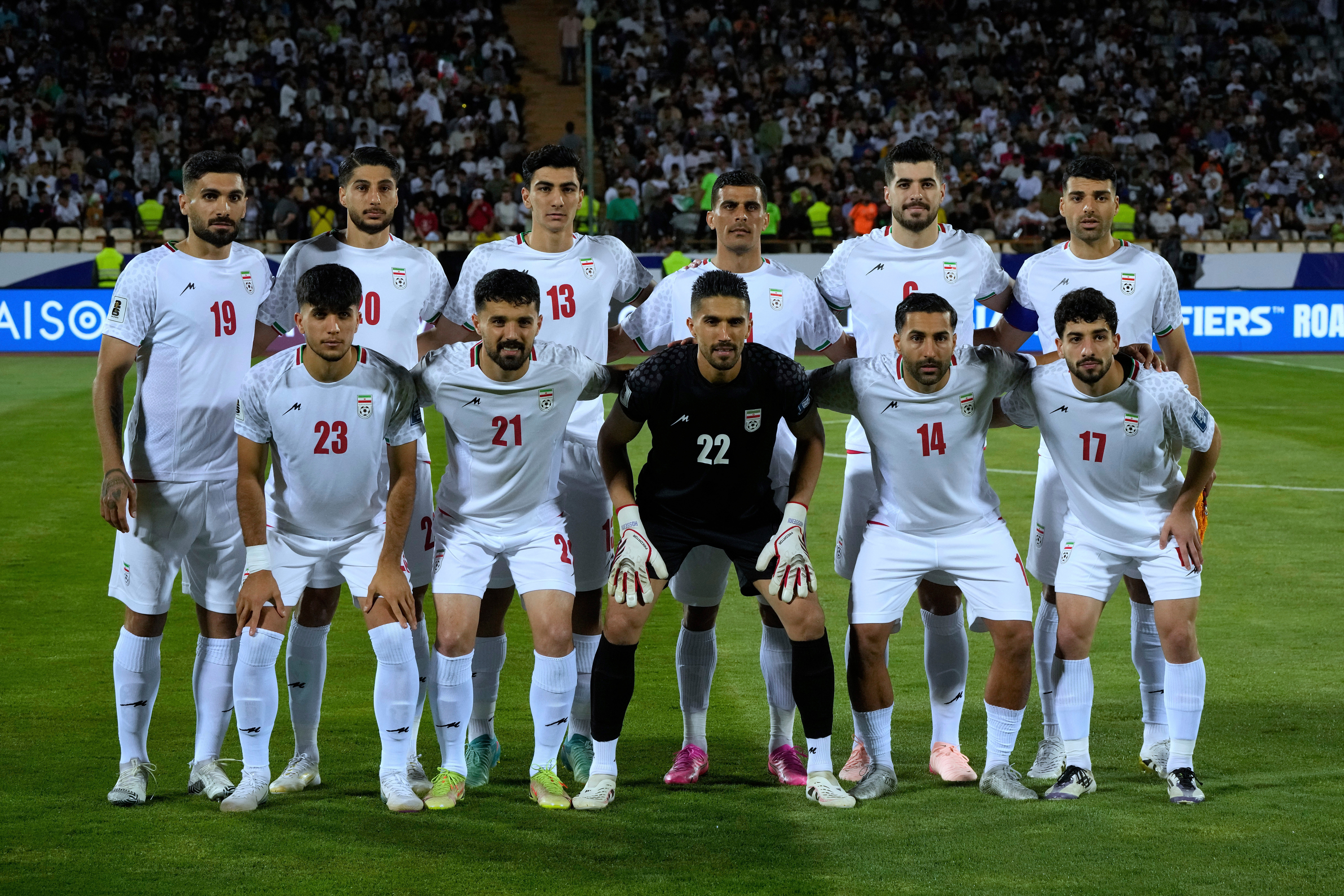 caption: FILE - Irans's players pose for a team photo before an Asian group A qualifying soccer match against North Korea for the 2026 World Cup, June 10, 2025, at Azadi Stadium in Tehran, Iran. 