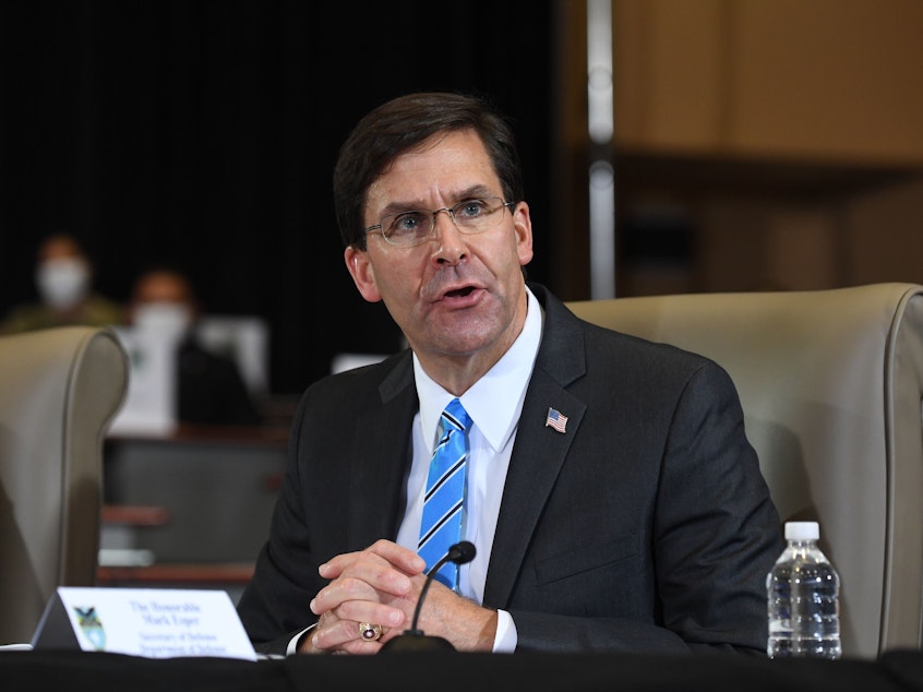caption: Defense Secretary Mark Esper, pictured earlier this month, announced a drawdown of U.S. troops in Germany on Wednesday.