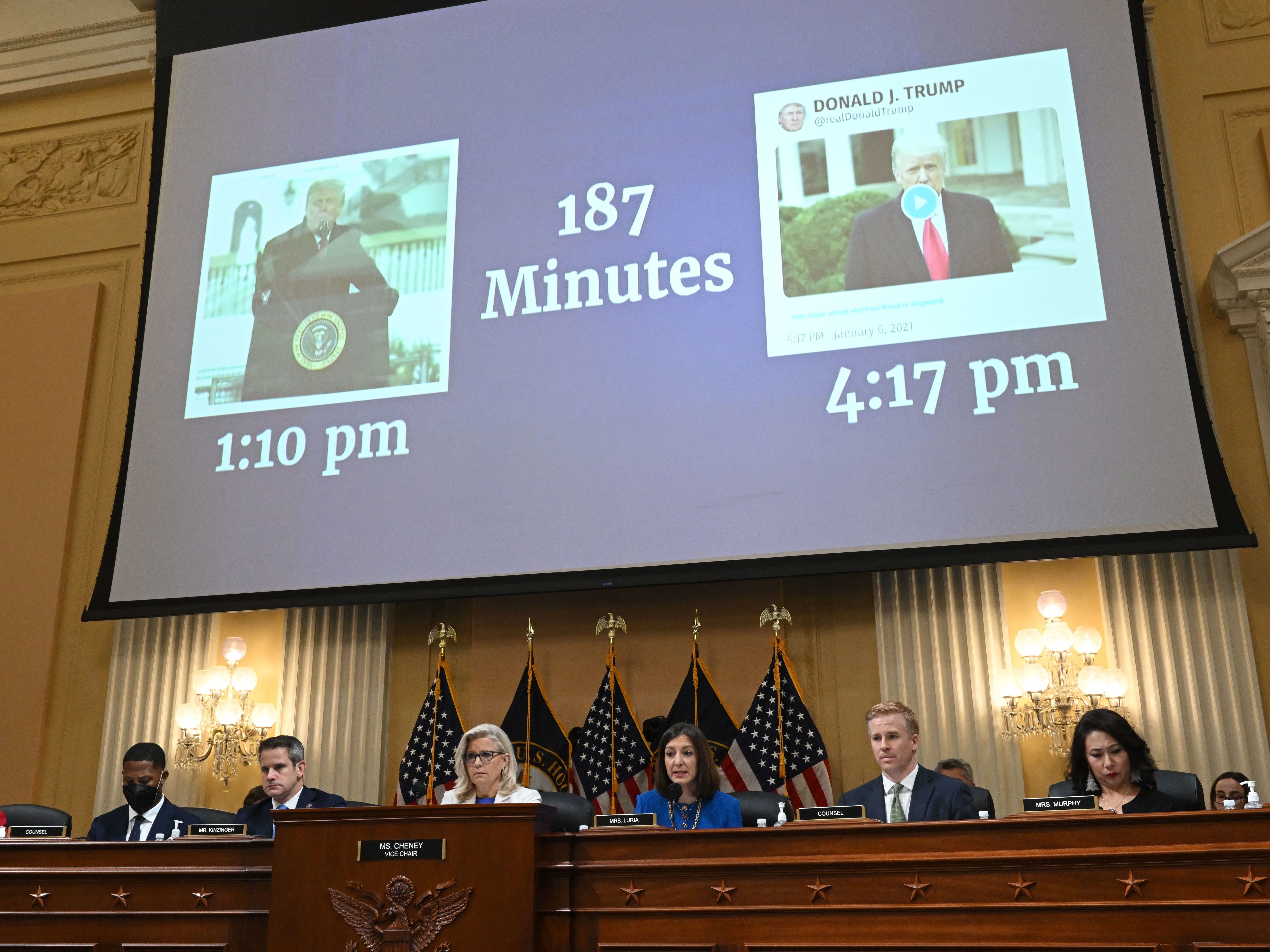caption: "187 Minutes" is displayed on a screen between images of former President Trump during a hearing by the House Select Committee on July 21, 2022.