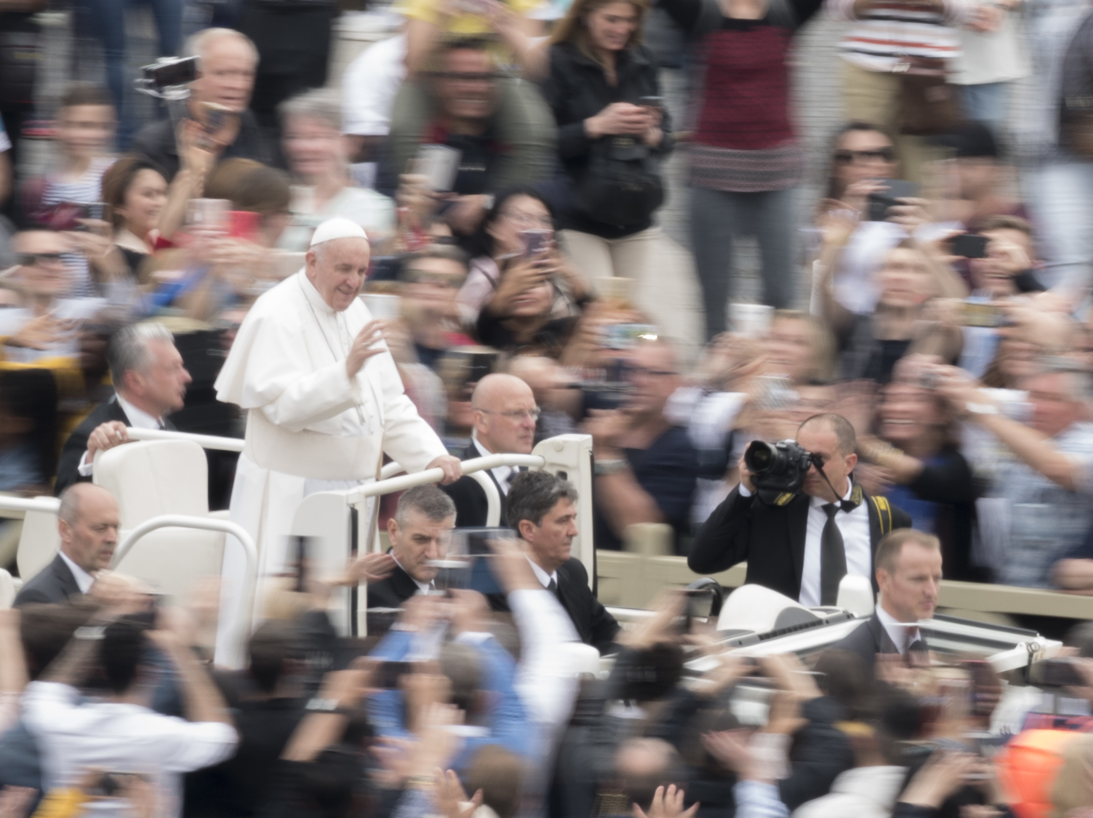 caption: Pope Francis waves to the crowd after celebrating Ester Mass in St. Peter's Square at the Vatican, Sunday, April 21, 2019.