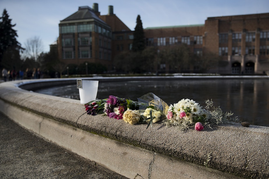 caption: Flowers are placed on the edge of the Drumheller Fountain on Thursday, February 7, 2019, on the University of Washington campus in Seattle. 