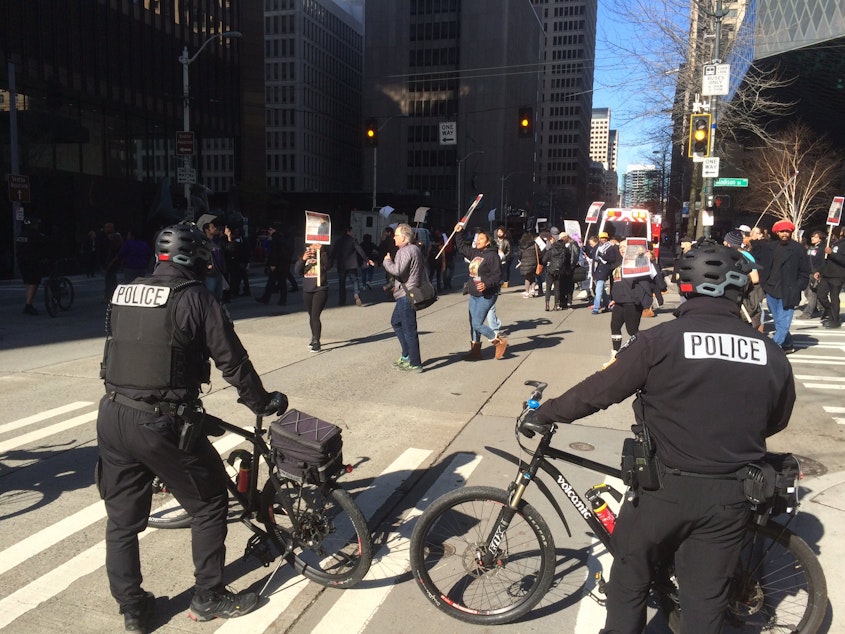 caption: A march protesting the Seattle police shooting of Che Taylor on Feb. 21, 2016 moves through downtown Seattle on Feb. 25, 2016.