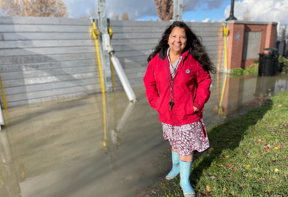 caption: Iris Carias, Mount Vernon City Councilmember, was at the Skagit River on November 16, 2021. She had spent the previous day driving around to migrant families to make sure they were okay amid the flooding conditions.