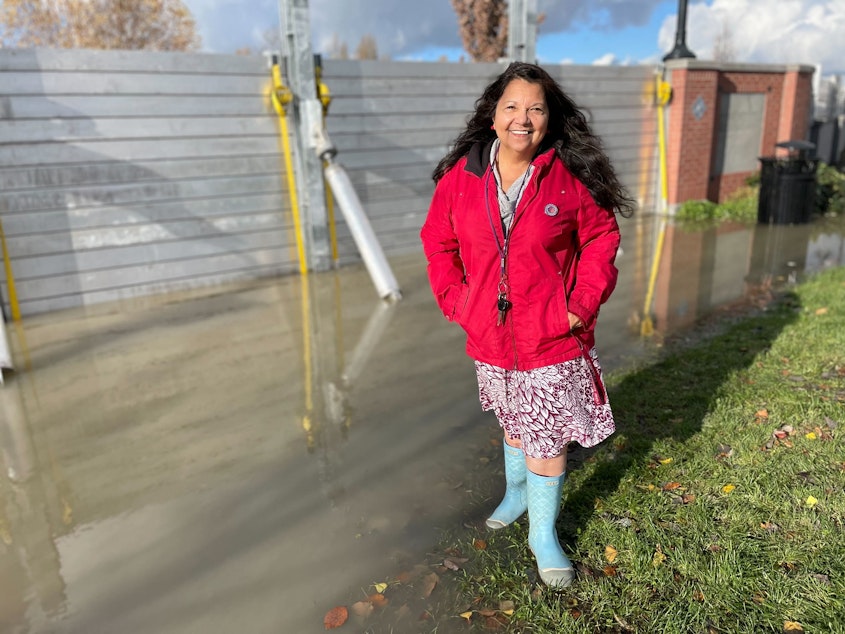 caption: Iris Carias, Mount Vernon City Councilmember, was at the Skagit River on November 16, 2021. She had spent the previous day driving around to migrant families to make sure they were okay amid the flooding conditions.