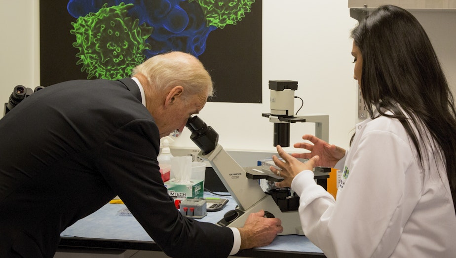 caption: Vice President Joe Biden toured the lab at Fred Hutchinson Cancer Research Center before holding a roundtable meeting with scientists there. Biden says he's encouraged to see more cooperation between researchers and doctors. 