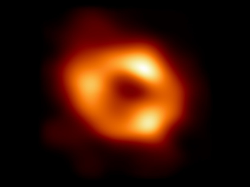caption: "It's the dawn of a new era of black hole physics," the Event Horizon Telescope team said as it released the first-ever image of supermassive black hole in the center of the Milky Way.