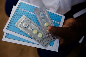 caption: Malaria Consortium providing antimalarial pills in Burkina Faso.