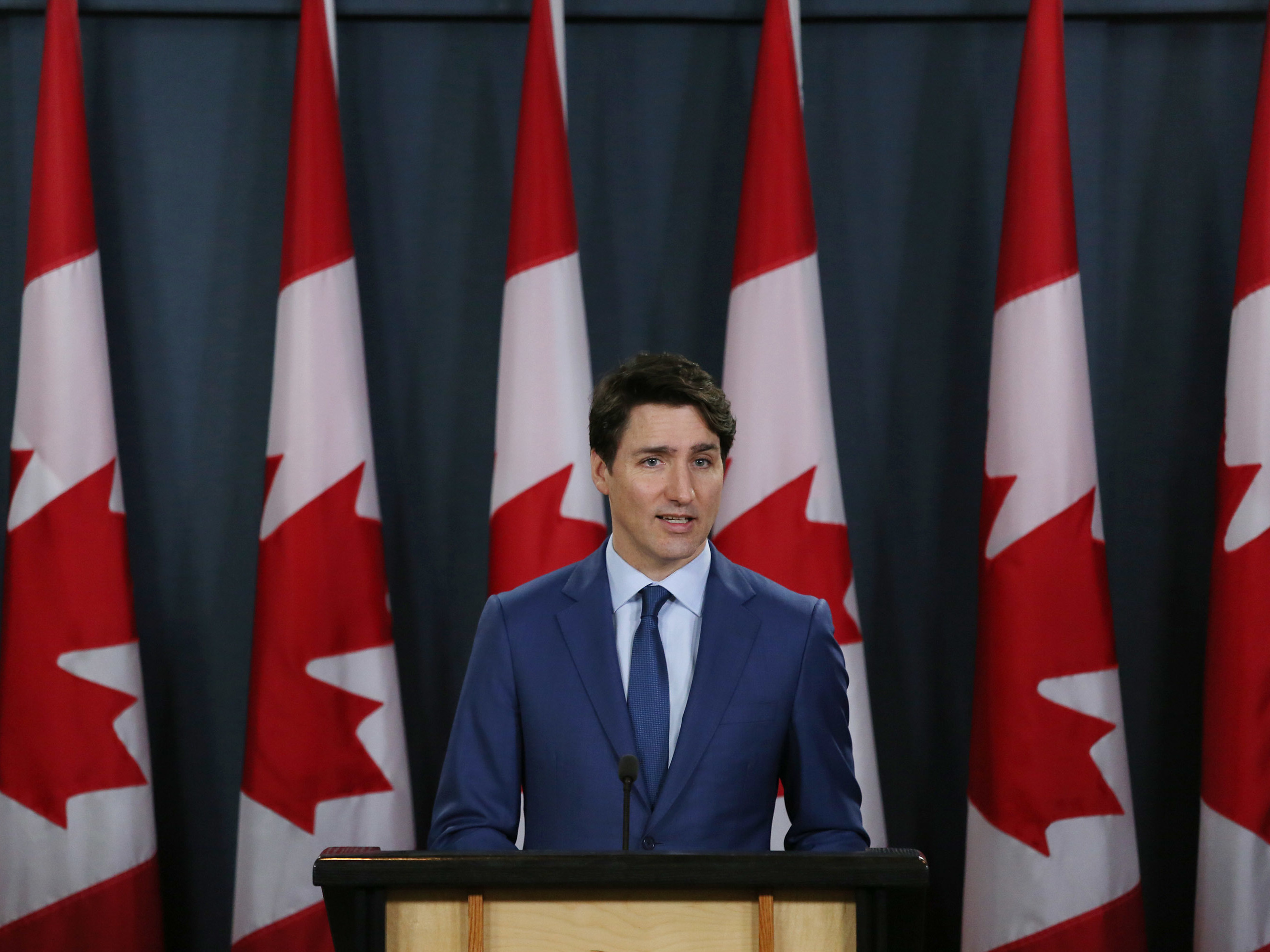 caption: Canada's Prime Minister Justin Trudeau talks to reporters at a news conference on March 7, in Ottawa, Canada. He was accused of interfering in a criminal investigation of SNC-Lavalin, a powerful engineering firm.
