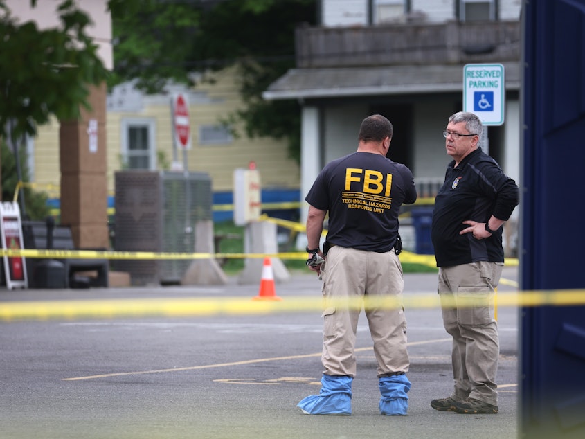 caption: As police and FBI agents continue their investigation into the shooting at Tops Market in Buffalo, N.Y., last weekend, Congress is considering legislation to address domestic terrorism. Authorities say the attack was believed to be motivated by racial hatred.