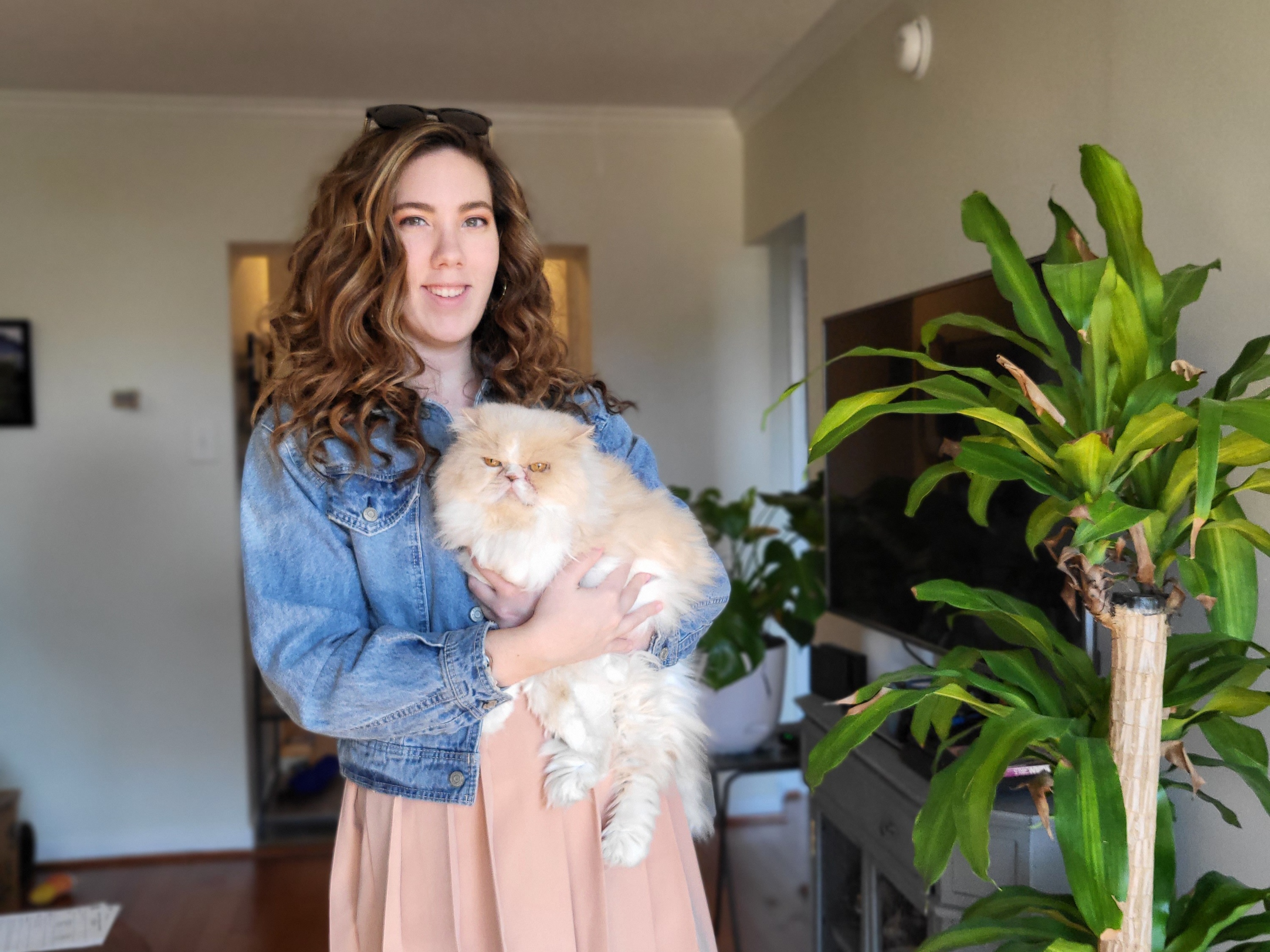 caption: Susan Burke is trying to sell her extra Beyoncé tickets on StubHub, but they are not showing up for most users. In this photo, Burke is posing with her cat, Peaches.