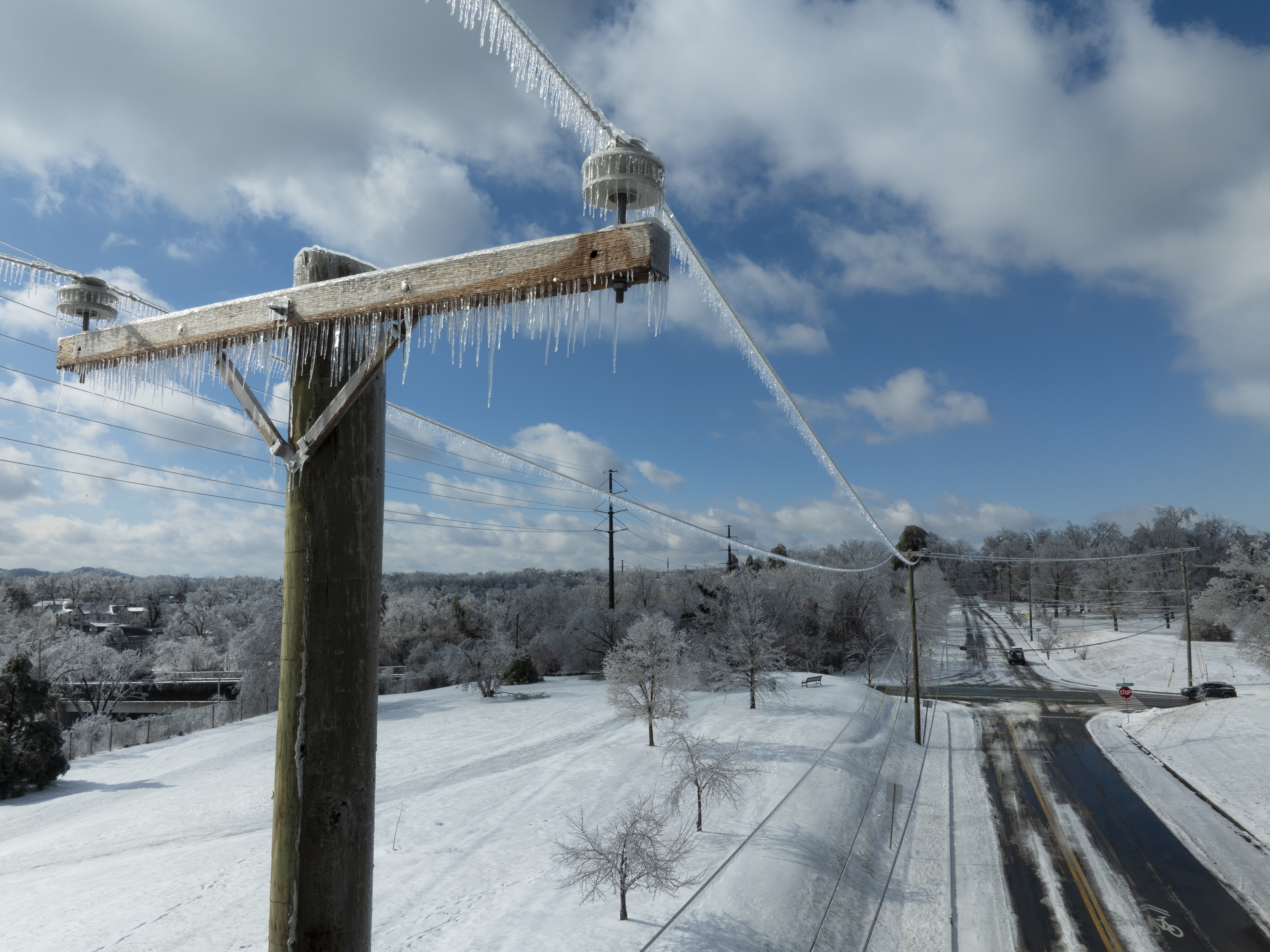 caption: In this aerial view, ice accumulates on utility lines Monday in Nashville, Tenn. A massive winter storm is bringing frigid temperatures, ice, and snow to tens of millions of Americans across the nation.