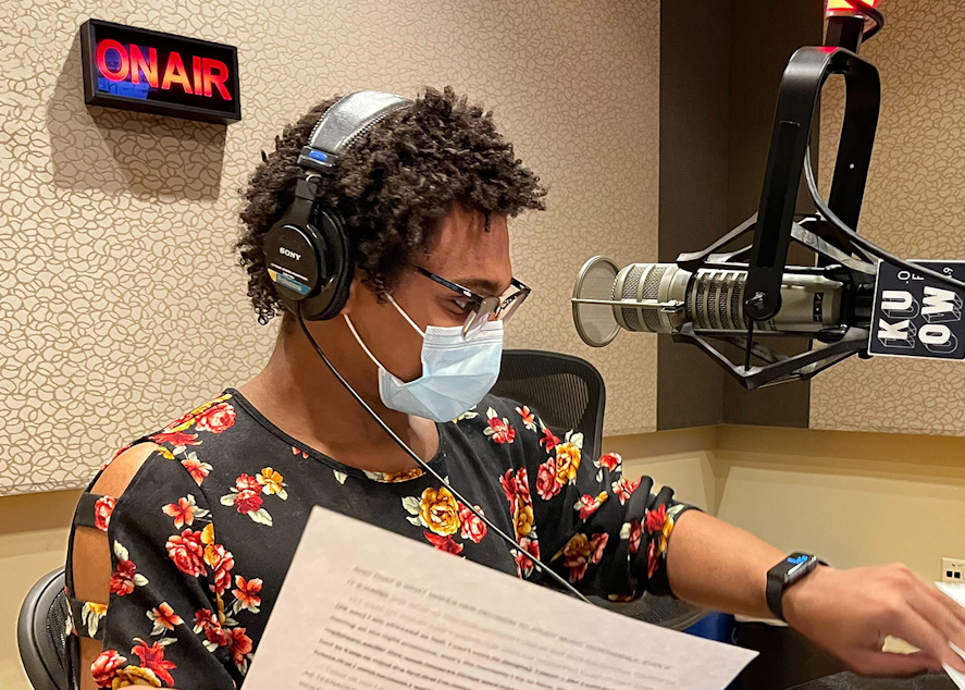 caption: Rhea Beecher records a podcast script in the KUOW studios on February 26, 2022 as part of the RadioActive Advanced Producers Workshop.