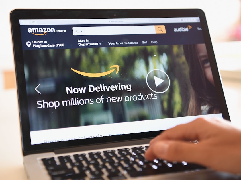 caption: The Amazon website is seen in 2017 in Dandenong, Australia. Amazon was among dozens of sites hit by a massive internet outage on Thursday.