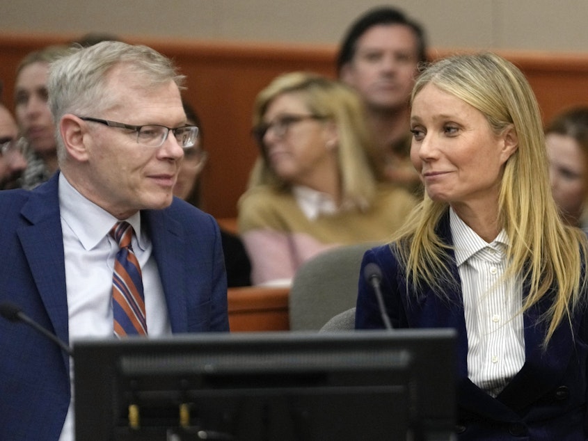 caption: Gwyneth Paltrow and her attorney Steve Owens smile after the reading of the verdict in her lawsuit trial on Thursday in Park City, Utah.