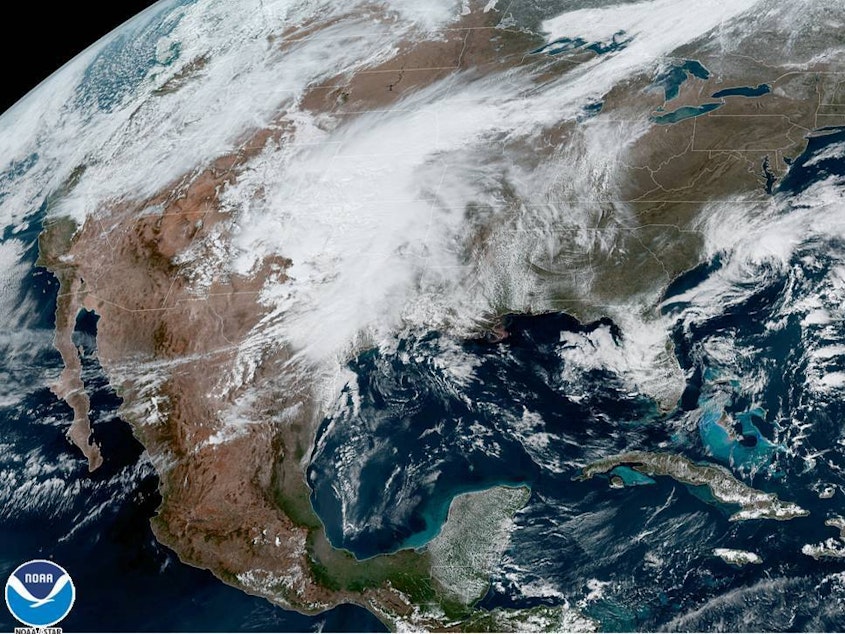 caption: A U.S. satellite captures cloud cover over North America on Monday. The National Oceanic and Atmospheric Administration announced it has upgraded its weather forecasting model to use more satellite weather data.