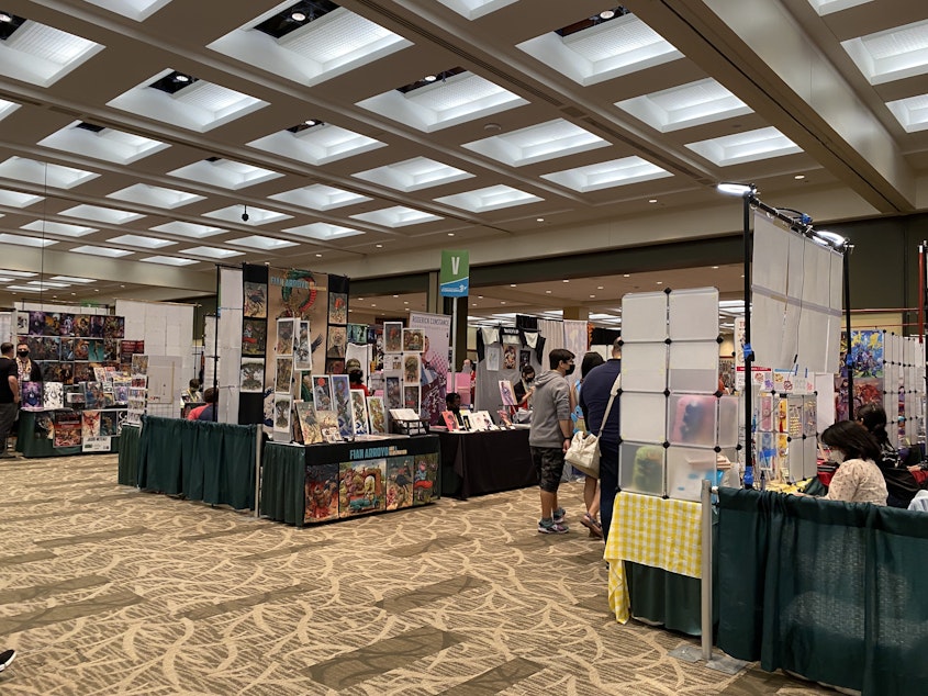 caption: The Artist Alley on the first day of Emerald City Comic Con, Aug. 18, 2022. The Artist Alley is full of artists selling merchandise like prints, stickers, keychains and apparel. 