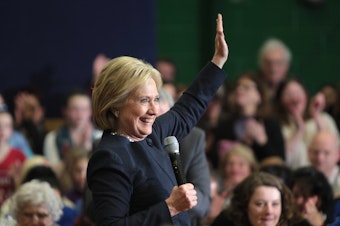 caption: Former Secretary of State Hillary Clinton speaking with supporters at a town hall meeting at Hillside Middle School in Manchester, New Hampshire on Jan. 22, 2016.