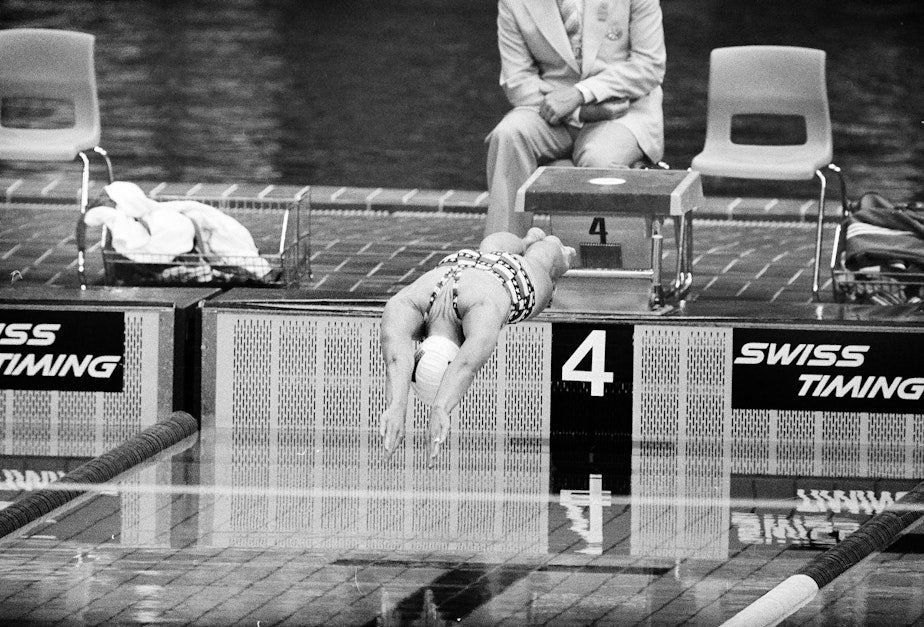 caption: U.S. swimmer Wendy Boglioli dives in to the pool to begin the second heat in the women's 100 meter butterfly competition at the Olympic pool in Montreal, Canada, July 21, 1976. 