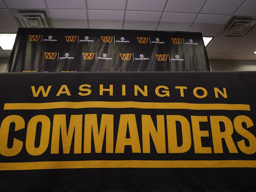 caption: The Washington Commanders football team's name and logo is seen at the NFL football team's facility in Ashburn, Va., on Nov. 10. A report Thursday by the U.S. House Committee on Oversight and Reform said the team created a "toxic work culture" for more than two decades, "ignoring and downplaying sexual misconduct" by men at the top levels of the organization.