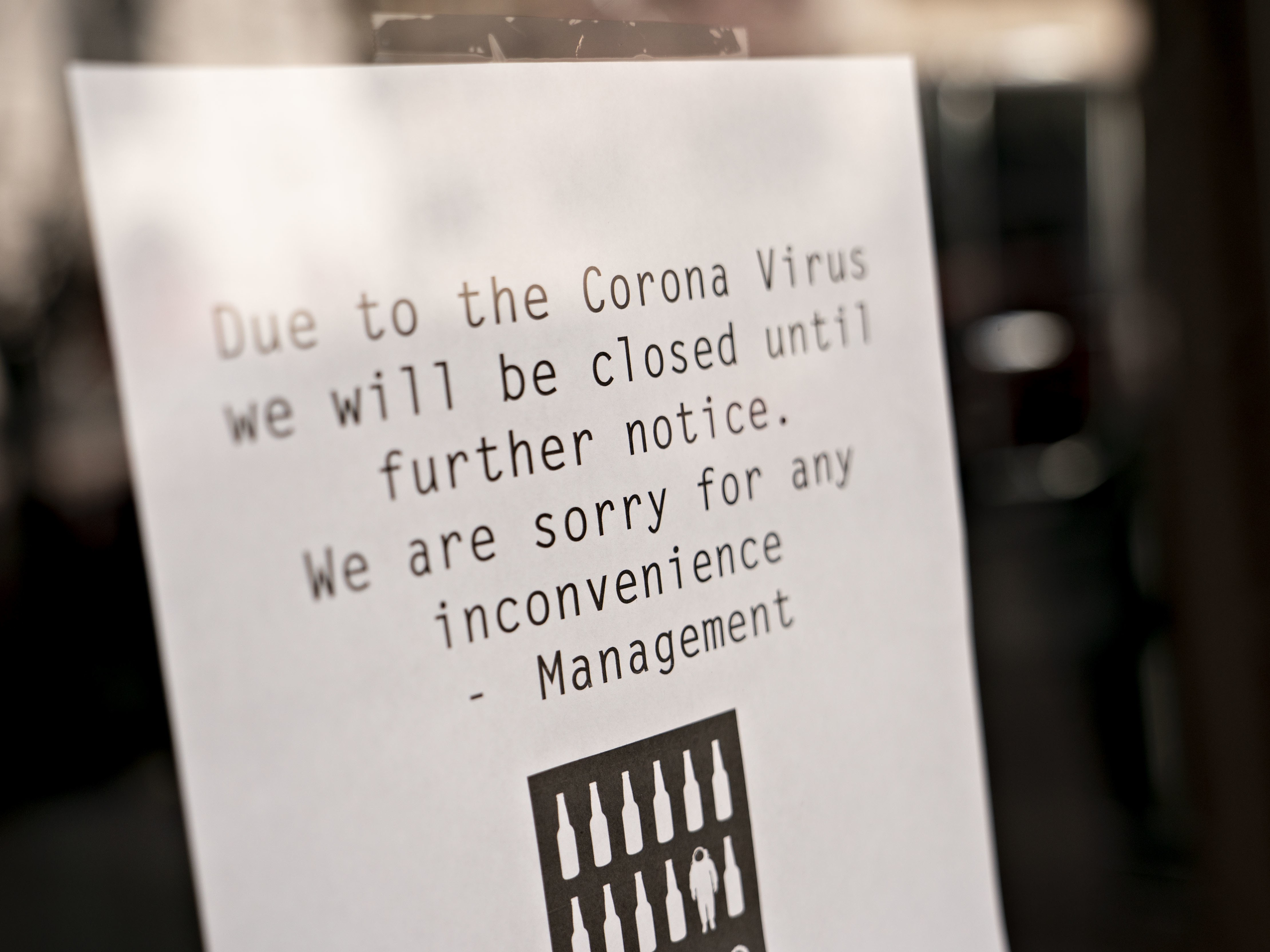 caption: A sign at a bar in Washington, D.C., alerts customers that it's closed due to the coronavirus outbreak. Lawmakers are considering big moves to assist small businesses.