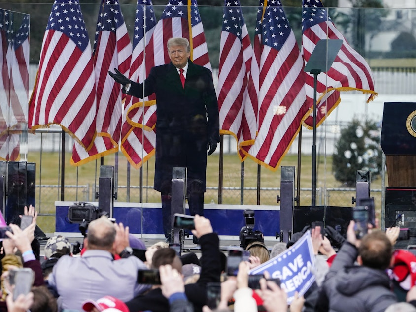 caption: In this Jan. 6, 2021 photo, President Donald Trump arrives to speak at a rally in Washington.