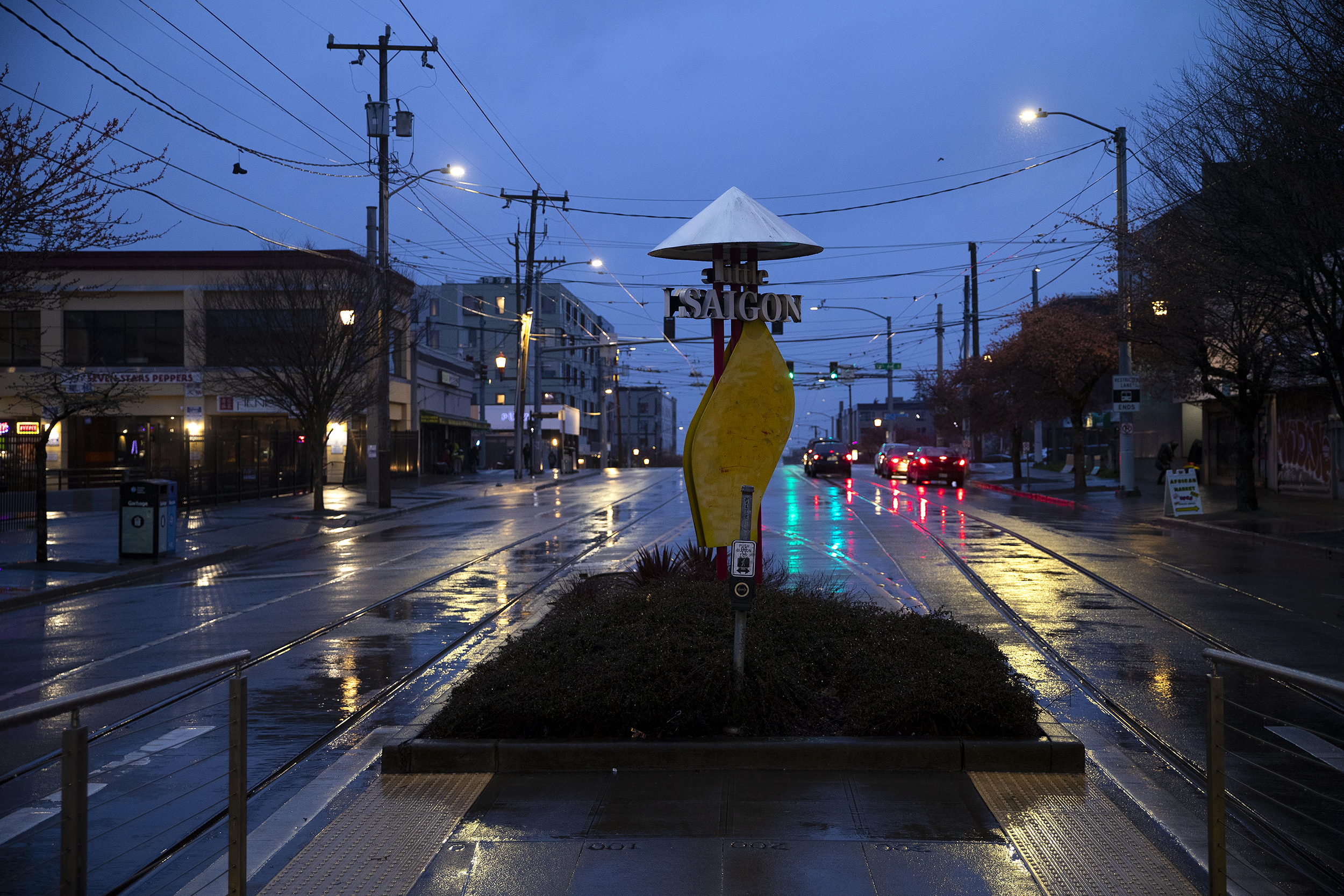 caption: Seattle’s Little Saigon neighborhood is shown as the sun goes down on Thursday, March 20, 2025, in Seattle. 