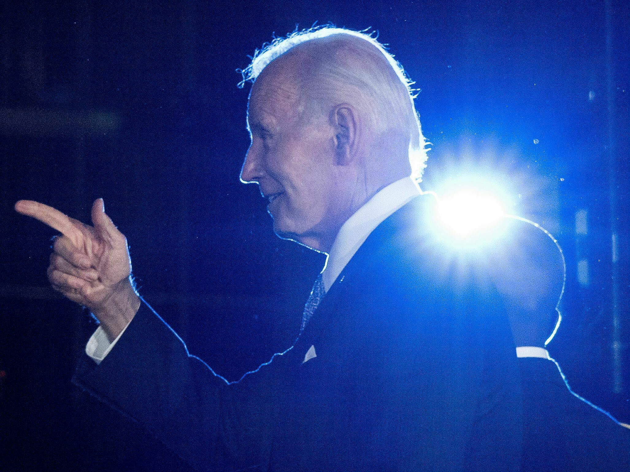 caption: President Biden gestures after speaking at a Juneteenth concert on June 13.