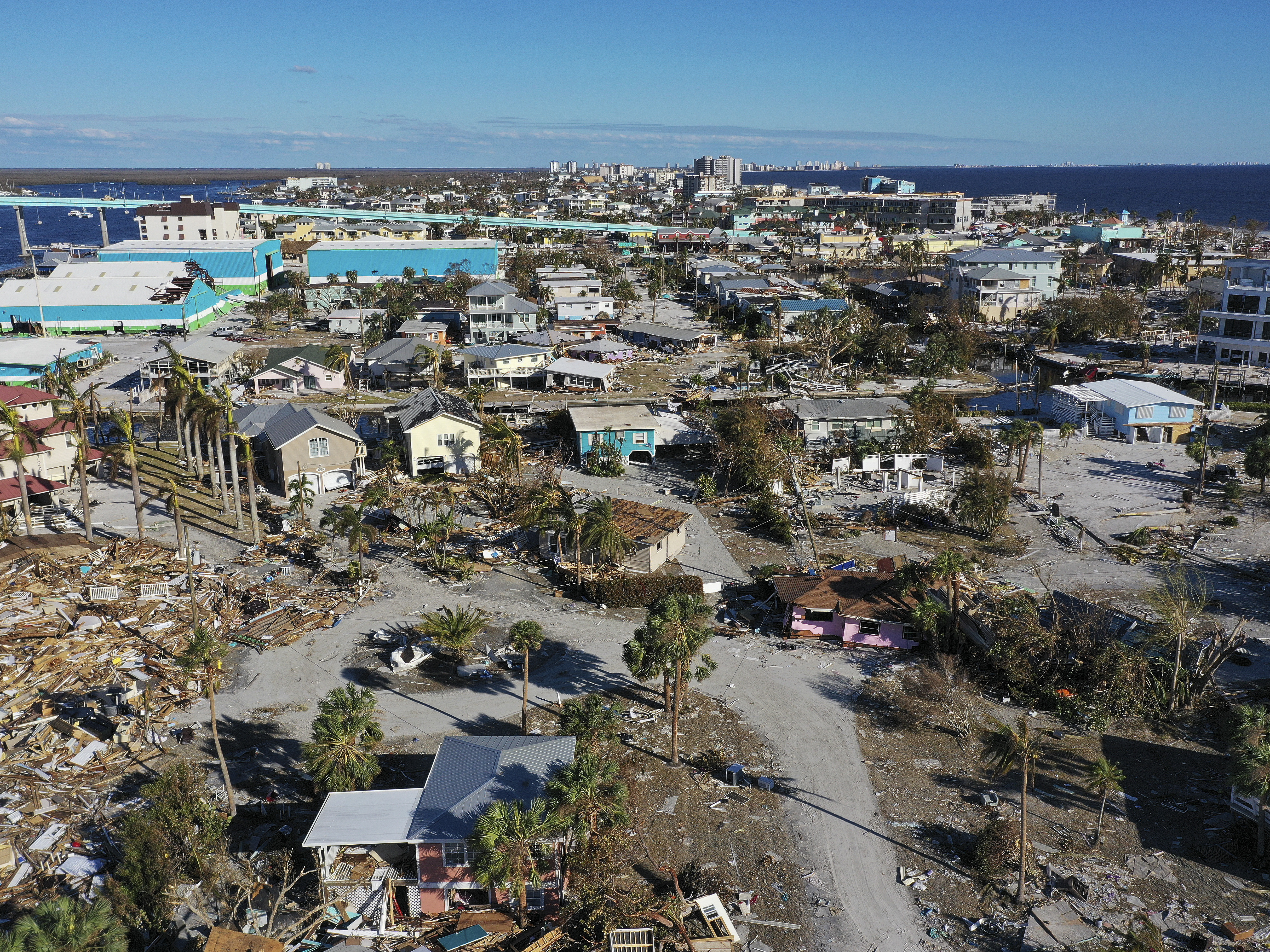 caption: In this aerial view, the destruction left in the wake of Hurricane Ian is shown on October 02, 2022 in Fort Myers Beach, Florida. The state's home insurance market is reeling after disasters like this one.