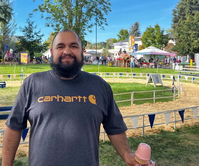 caption: Jaime Ibarra at the 2022 Central Washington Fair in Yakima said he recently became a U.S. citizen, and plans to vote for the first time this fall at age 31. 
