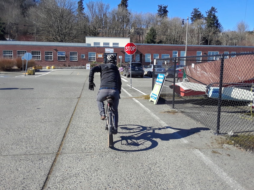 caption: Cascade Bicycle Club's Ryan Young teaches people how to ride safely. He says bicyclists should think of themselves as vehicles and yield to pedestrians.