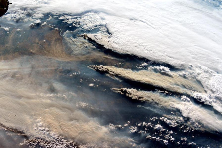 caption: Smoke from wildfires in the Northwest stream in this photo taken from the International Space Station.